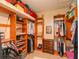 Walk-in closet with custom wooden shelving and drawers providing ample storage space at 3254 Grassglen Pl, Wesley Chapel, FL 33544