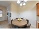 Cozy dining area featuring a round wood table and comfortable seating at 3254 Grassglen Pl, Wesley Chapel, FL 33544