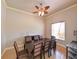 Formal dining room featuring a large table with upholstered chairs and tiled flooring at 3254 Grassglen Pl, Wesley Chapel, FL 33544
