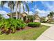 Charming single-story home with well-maintained landscaping, green grass, and a two-car garage at 3254 Grassglen Pl, Wesley Chapel, FL 33544