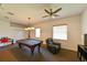 Game room featuring a pool table and comfortable seating, perfect for entertainment and relaxation at 3254 Grassglen Pl, Wesley Chapel, FL 33544