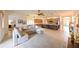 Open-concept living area seamlessly connects to the kitchen, creating a bright and inviting space at 3254 Grassglen Pl, Wesley Chapel, FL 33544