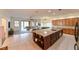 Open concept living area seamlessly connects the kitchen and living room spaces at 3254 Grassglen Pl, Wesley Chapel, FL 33544