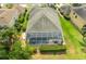 Aerial view of a home highlighting a private screened-in pool and patio area for outdoor relaxation at 3254 Grassglen Pl, Wesley Chapel, FL 33544