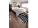 Bedroom featuring a wooden headboard, hardwood floors, and area rug at 3306 Lacewood Rd, Tampa, FL 33618