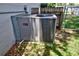 Side view of an outdoor HVAC unit, showcasing recent maintenance and efficient cooling system at 3306 Lacewood Rd, Tampa, FL 33618