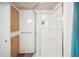 Modern bathroom featuring a clear glass shower and built-in storage at 36848 Beth Ave, Zephyrhills, FL 33542