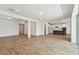 Spacious living area with tile floors, open layout, and views to the modern kitchen at 37194 Clinch Cir, Zephyrhills, FL 33540