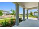 Comfortable porch shows landscaping in a newly constructed community at 37194 Clinch Cir, Zephyrhills, FL 33540