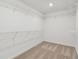 Walk-in closet with wire shelving and neutral carpet at 37194 Clinch Cir, Zephyrhills, FL 33540