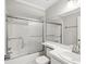 Bathroom with a tub and shower, a shower door, and a clean, white vanity at 4016 Lighthouse Way, New Port Richey, FL 34652