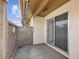 A private patio with a wooden fence and a sliding glass door that leads inside at 4016 Lighthouse Way, New Port Richey, FL 34652