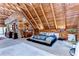 Bedroom with high ceilings, wooden beams, bed, dressers, and view to the outdoors at 4126 Burrows Rd, Zephyrhills, FL 33542