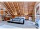 Bright bedroom featuring vaulted ceilings, wood beams, bed, dresser, and view to the outdoors at 4126 Burrows Rd, Zephyrhills, FL 33542