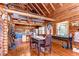 The dining area offers a unique space with artful touches, rustic charm, and an open view to the kitchen at 4126 Burrows Rd, Zephyrhills, FL 33542