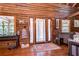 Cozy entryway featuring natural wood accents, a patterned rug, and decorative furniture at 4126 Burrows Rd, Zephyrhills, FL 33542