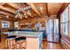 Modern kitchen featuring a large island with bar seating, stainless steel appliances, and ample counter space at 4126 Burrows Rd, Zephyrhills, FL 33542