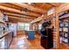 Cozy log cabin kitchen with a retro refrigerator, marble island, and plenty of storage at 4126 Burrows Rd, Zephyrhills, FL 33542