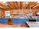 Kitchen view featuring stainless steel appliances, open shelving, marble countertops and wood cabinets at 4126 Burrows Rd, Zephyrhills, FL 33542
