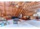 Expansive living room featuring vaulted ceilings, wood beams, and multiple ceiling fans at 4126 Burrows Rd, Zephyrhills, FL 33542