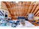 Open living space featuring exposed beams, modern furniture, and a zebra hide rug at 4126 Burrows Rd, Zephyrhills, FL 33542