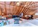 Open living space featuring exposed beams, modern furniture, and a decorative area rug at 4126 Burrows Rd, Zephyrhills, FL 33542