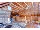 Spacious loft features exposed beams, wooden walls, and hardwood floors at 4126 Burrows Rd, Zephyrhills, FL 33542