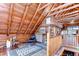 Open loft with wooden walls and ceiling, featuring a cozy seating area and unique decor at 4126 Burrows Rd, Zephyrhills, FL 33542