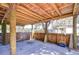 Spacious covered patio with wooden beams, perfect for outdoor entertaining and relaxation at 4126 Burrows Rd, Zephyrhills, FL 33542
