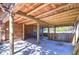 Open-air patio featuring wood beams, ideal for relaxation and outdoor gatherings at 4126 Burrows Rd, Zephyrhills, FL 33542