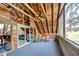 Covered porch with wood ceiling and support beams offers a cozy outdoor living space at 4126 Burrows Rd, Zephyrhills, FL 33542