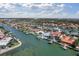 Stunning aerial view of waterfront home with boat dock and bay access, surrounded by lush landscaping and neighboring houses at 4333 48Th S Ave, St Petersburg, FL 33711