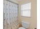 Bathroom featuring shower with decorative curtain at 4333 48Th S Ave, St Petersburg, FL 33711