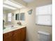Bright bathroom featuring a vanity with granite countertop and decorative accents at 4333 48Th S Ave, St Petersburg, FL 33711