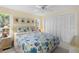 Inviting bedroom with a queen bed, ceiling fan, and ample closet space at 4333 48Th S Ave, St Petersburg, FL 33711