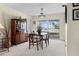 Cozy dining room with a wooden table, seating for four, and a large window overlooking the waterfront at 4333 48Th S Ave, St Petersburg, FL 33711