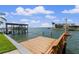 A dock with boat lift and bench provides direct access to the serene canal at 4333 48Th S Ave, St Petersburg, FL 33711
