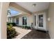 Inviting front entrance featuring a beautifully designed glass door, brick pathway, and decorative landscaping at 4333 48Th S Ave, St Petersburg, FL 33711