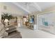 Open-concept living room with tile and carpeted floors at 4333 48Th S Ave, St Petersburg, FL 33711