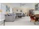 Bright and airy living room with plush seating, neutral decor, and large windows offering ample natural light at 4333 48Th S Ave, St Petersburg, FL 33711