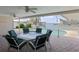 Outdoor patio featuring a table, chairs, and lovely waterfront views and a swimming pool at 4333 48Th S Ave, St Petersburg, FL 33711