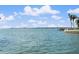 Scenic waterfront view with clear blue water and a dock extending into the bay, perfect for boating enthusiasts at 4333 48Th S Ave, St Petersburg, FL 33711