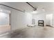 Spacious garage featuring concrete flooring, overhead lighting, and access to the interior of the home at 4513 Bay Spring Ct, Tampa, FL 33611