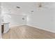 Bright living room featuring wood-look flooring, a ceiling fan, and large window at 4513 Bay Spring Ct, Tampa, FL 33611