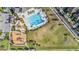 Aerial view of community with swimming pool, playground, and recreation areas at 4550 Globe Thistle Dr, Tampa, FL 33619