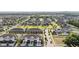 Expansive aerial view showcasing a planned community with townhomes and manicured green spaces at 4550 Globe Thistle Dr, Tampa, FL 33619