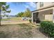 Home featuring a cozy screened-in patio and spacious backyard, perfect for outdoor relaxation at 4550 Globe Thistle Dr, Tampa, FL 33619