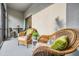 Relaxing screened balcony with wicker furniture at 4550 Globe Thistle Dr, Tampa, FL 33619