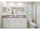 Bathroom featuring a double sink vanity with granite countertops and ample cabinet space at 4550 Globe Thistle Dr, Tampa, FL 33619