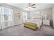 Cozy bedroom with large windows, plush carpet, and a comfortable bed at 4550 Globe Thistle Dr, Tampa, FL 33619